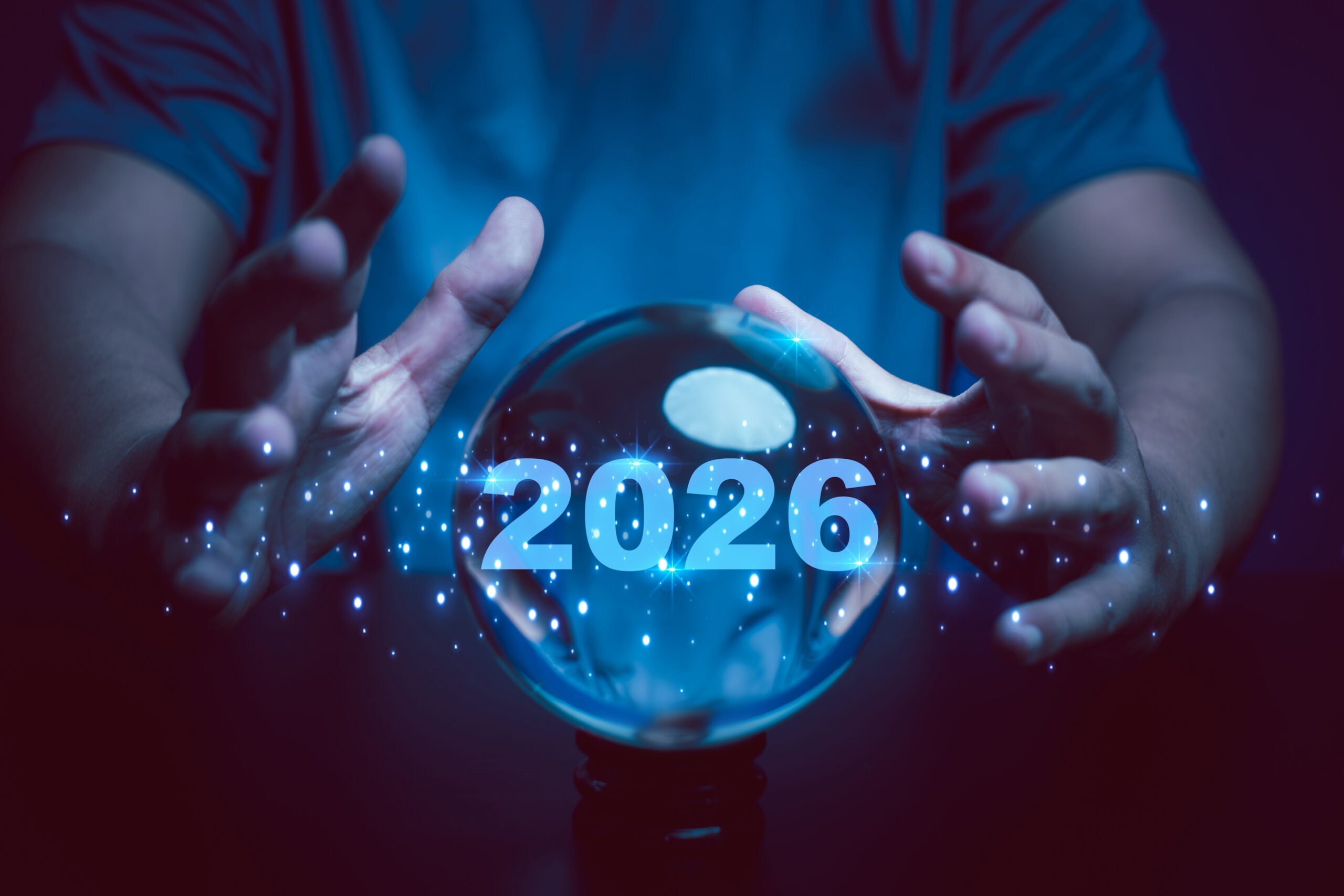 2026 in crystal ball with two hands positioned in fortune-telling mode