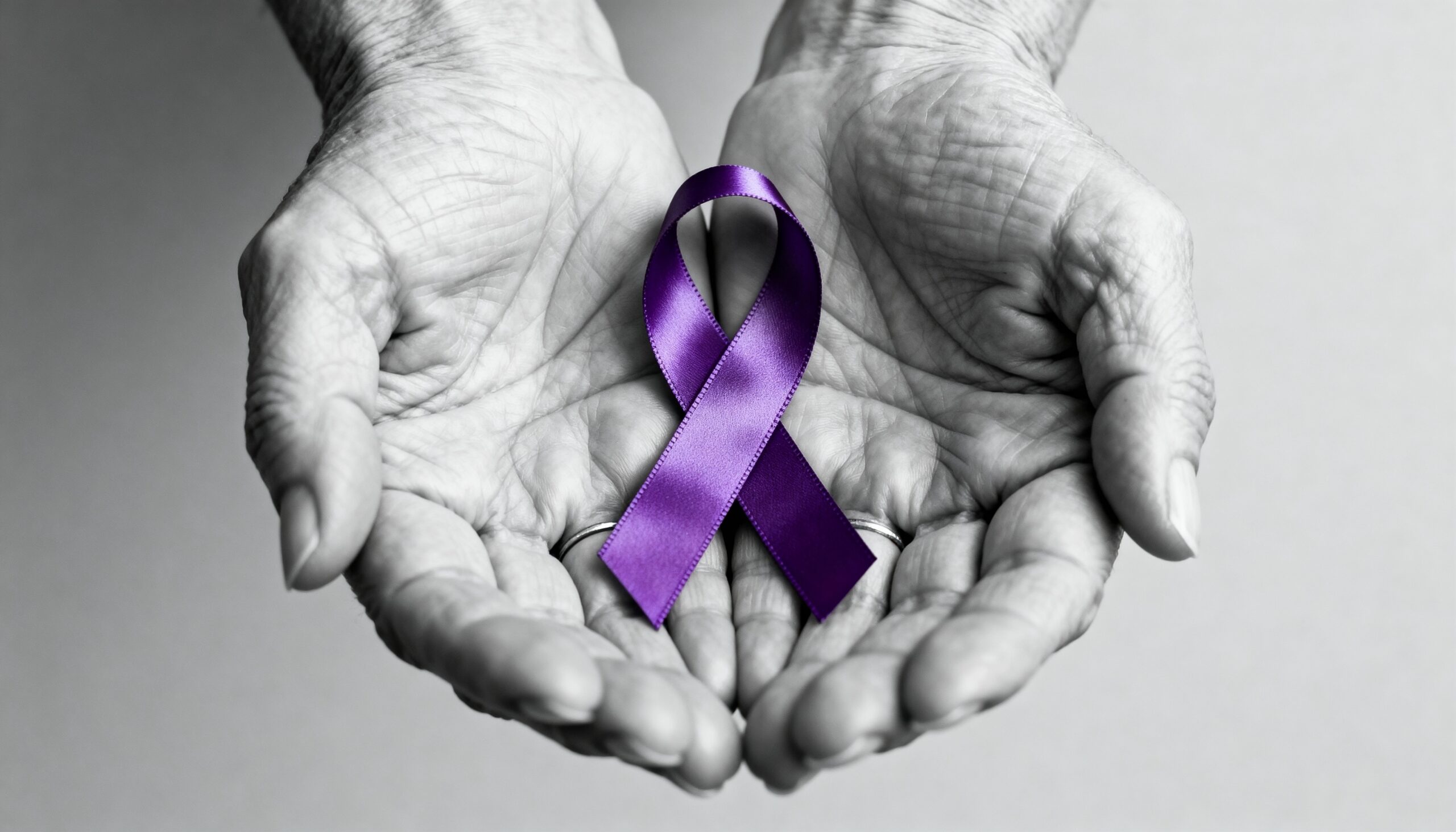 Purple Awareness Ribbon in Aged Hands
