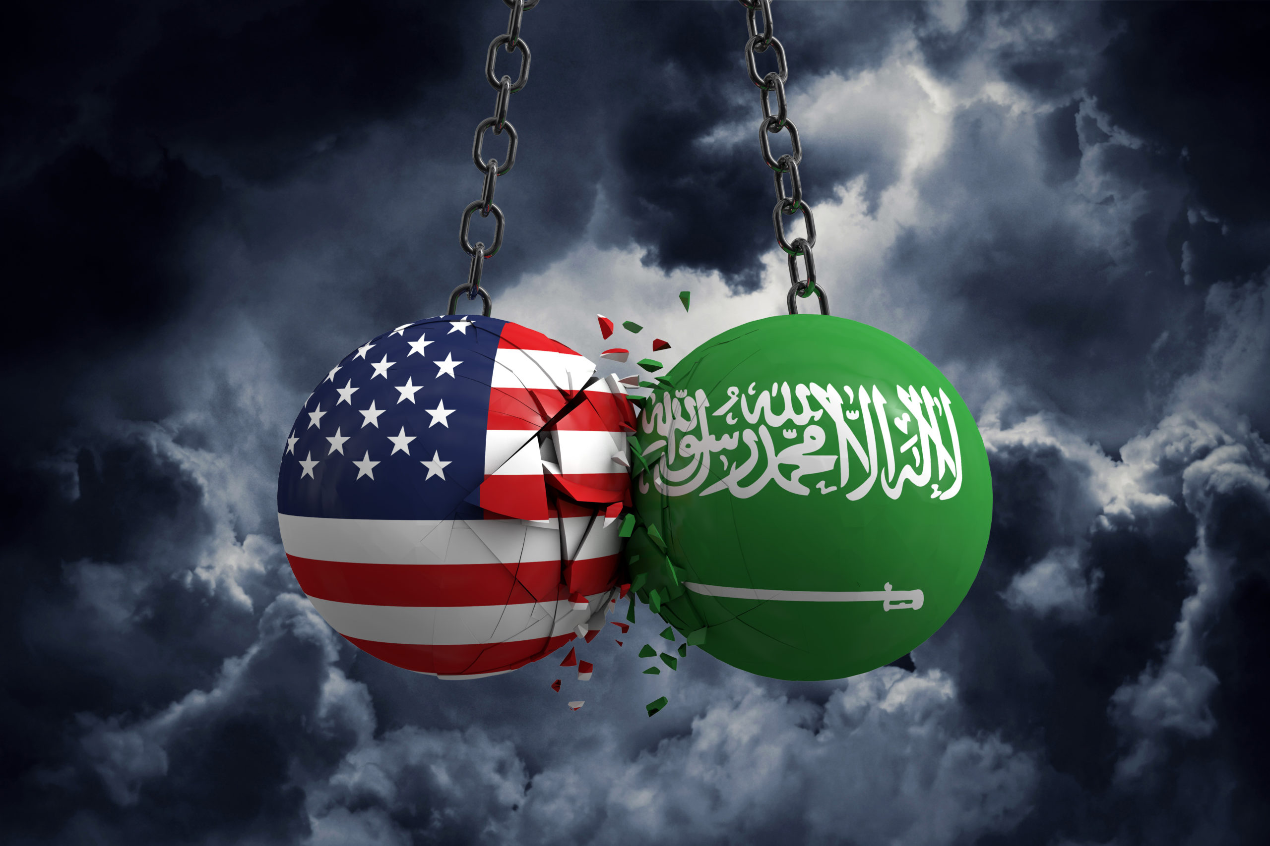 Two wrecking balls colliding - one with American flag, one with Saudi flag