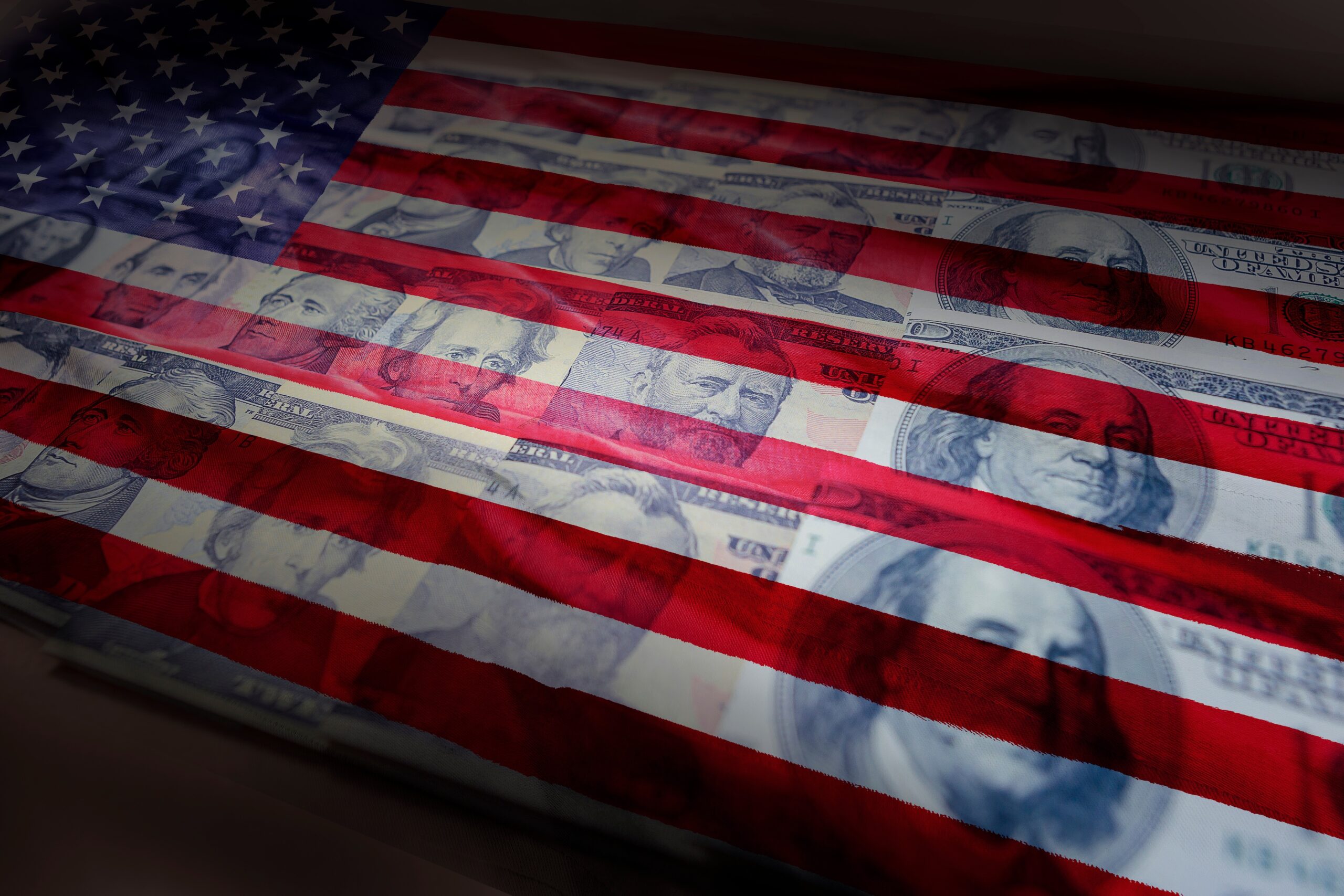 American flag with faded U.S. currency images iimpressed beneath