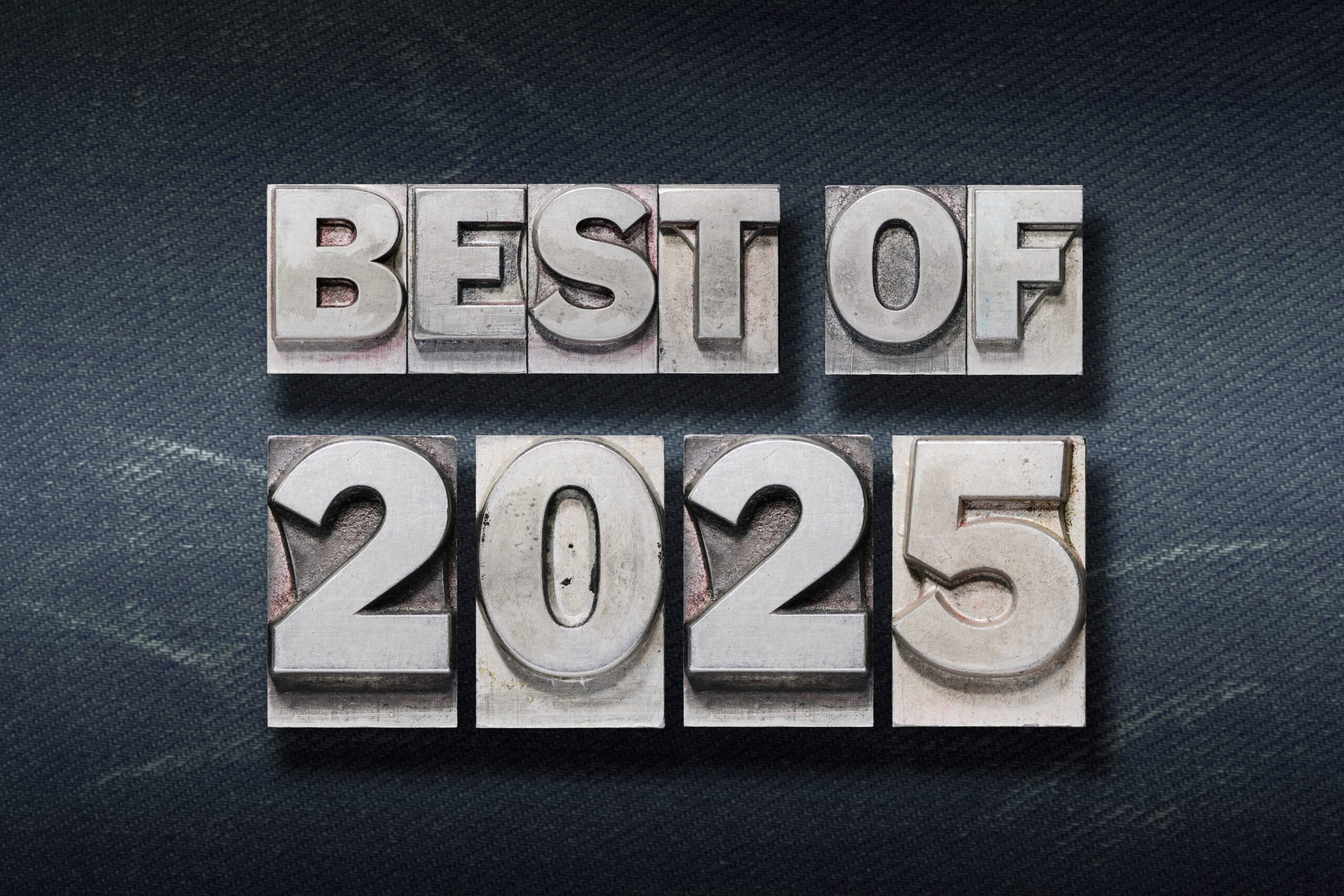 "Best of 2025" made from wooden letterpress on dark jeans background