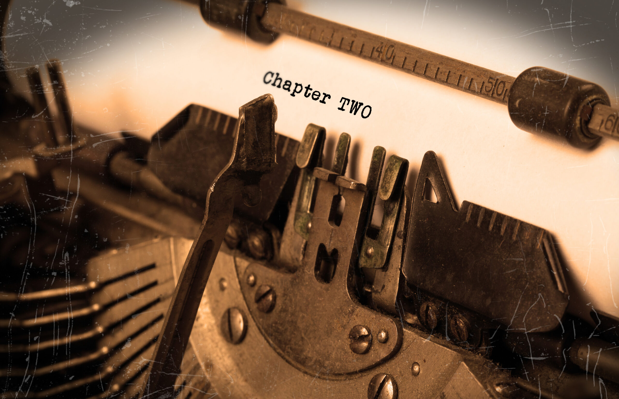 Old typewriter with paper with the words "Chapter Two"