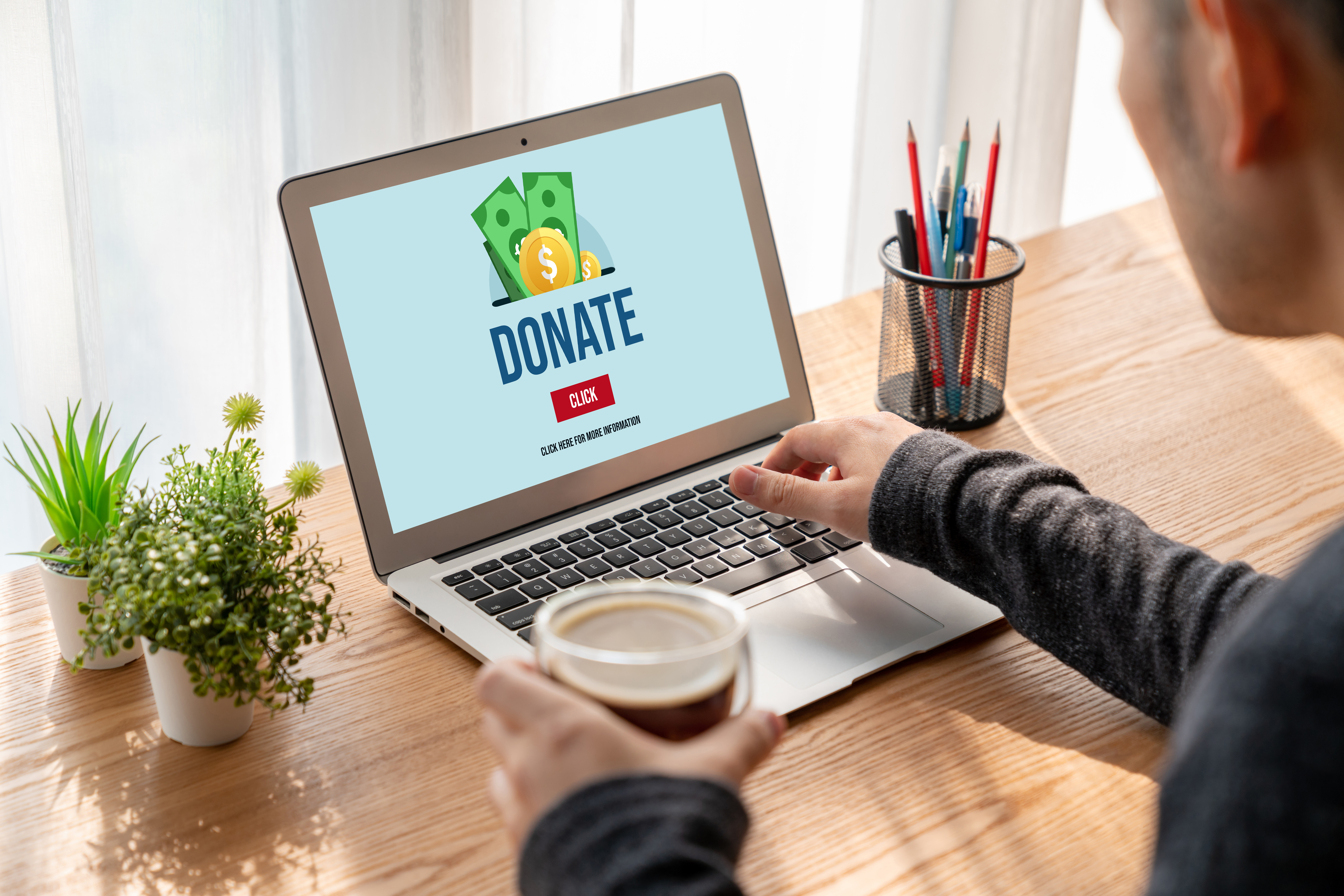 Laptop with screen showing "Donate" webpage