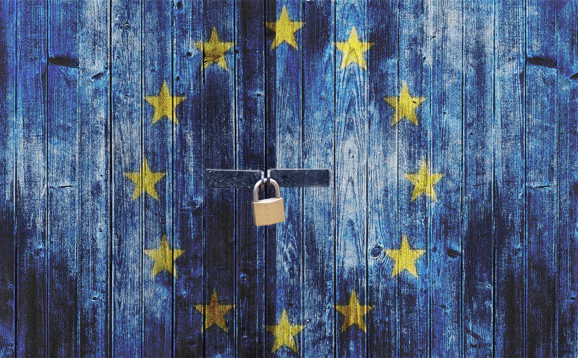 EU symbol on wooden gate locked with padlock