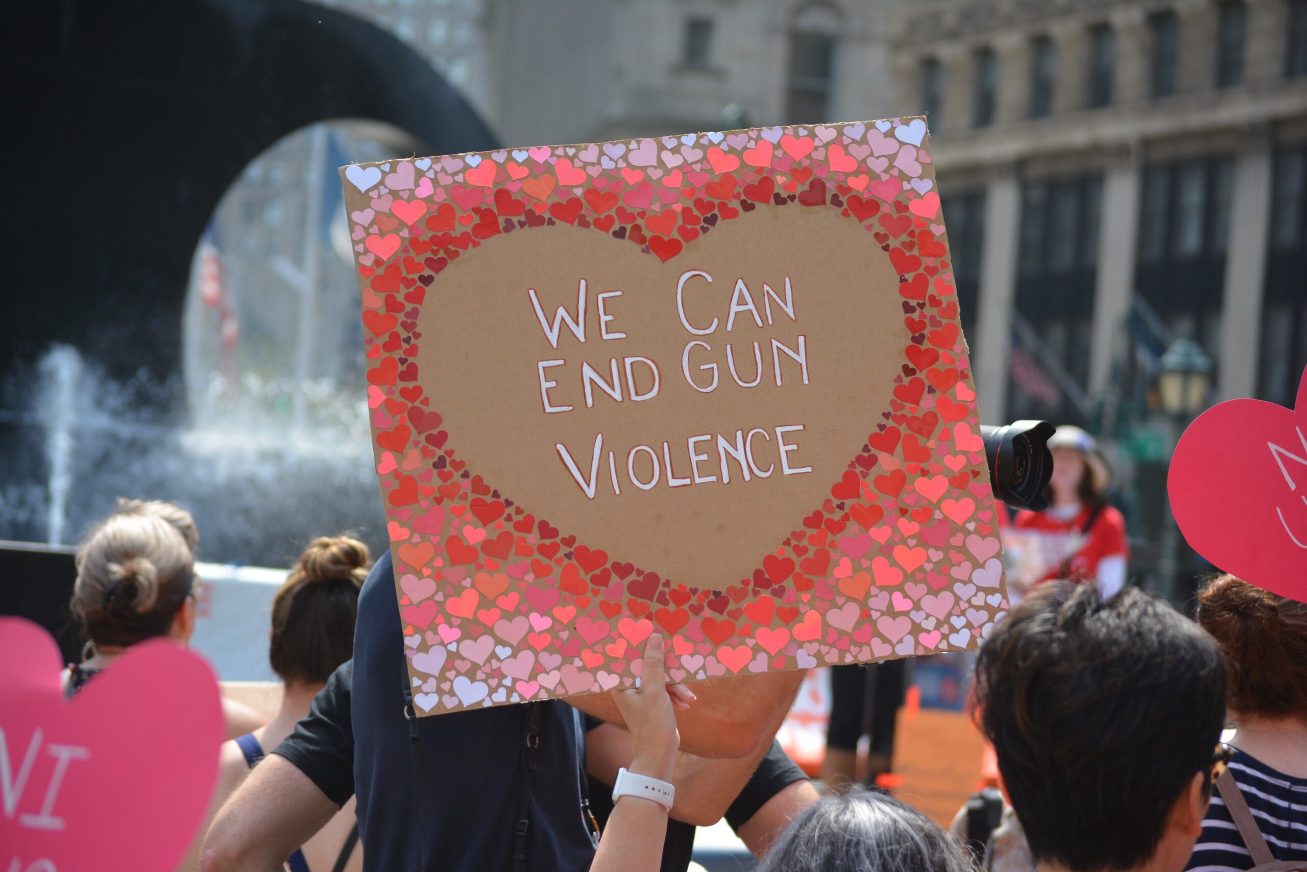 "We Can End Gun Violence" in a Heart-Shaped Sign - Protest