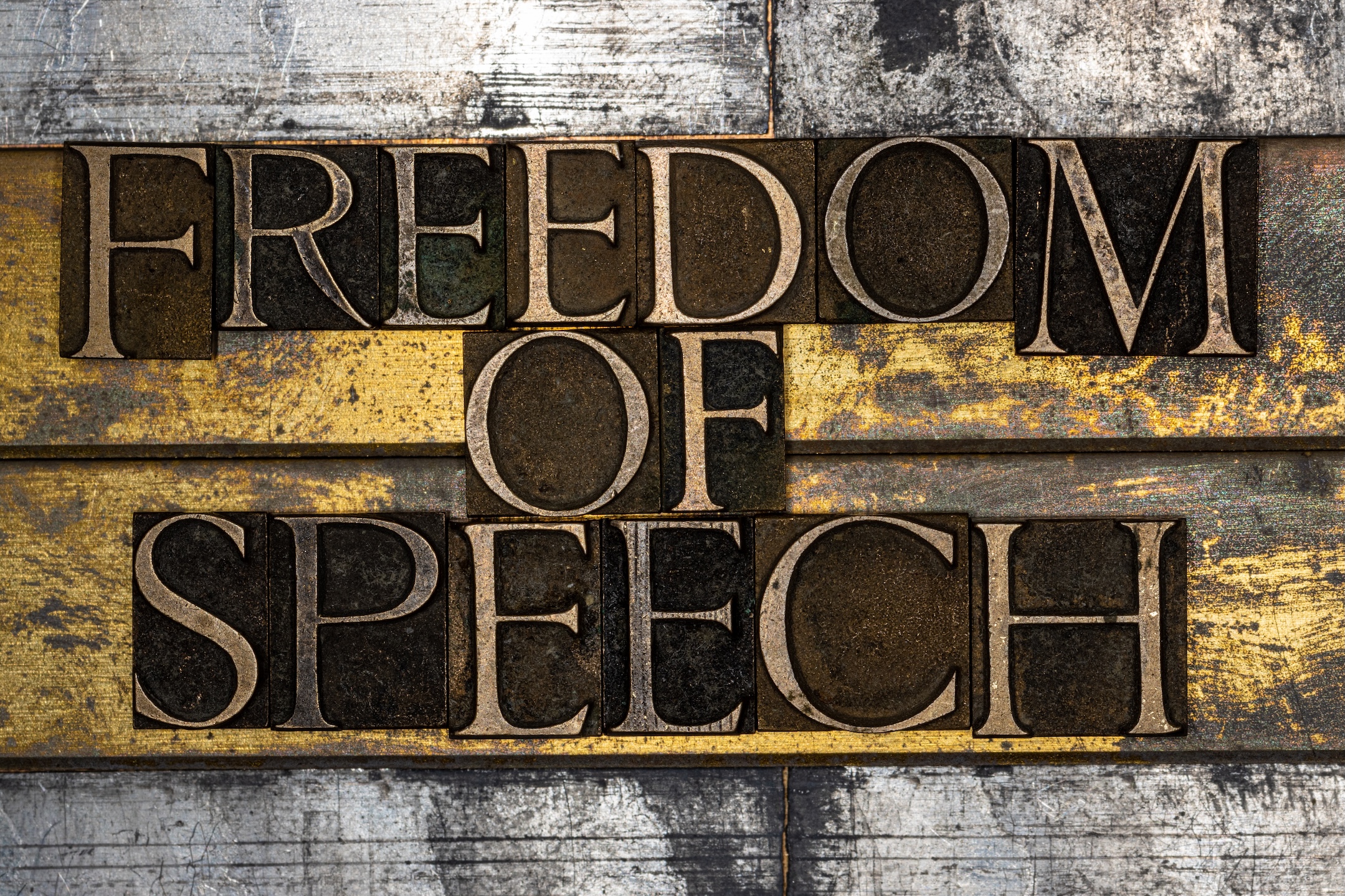 Photo of real authentic typeset letters forming "Freedom of Speech"