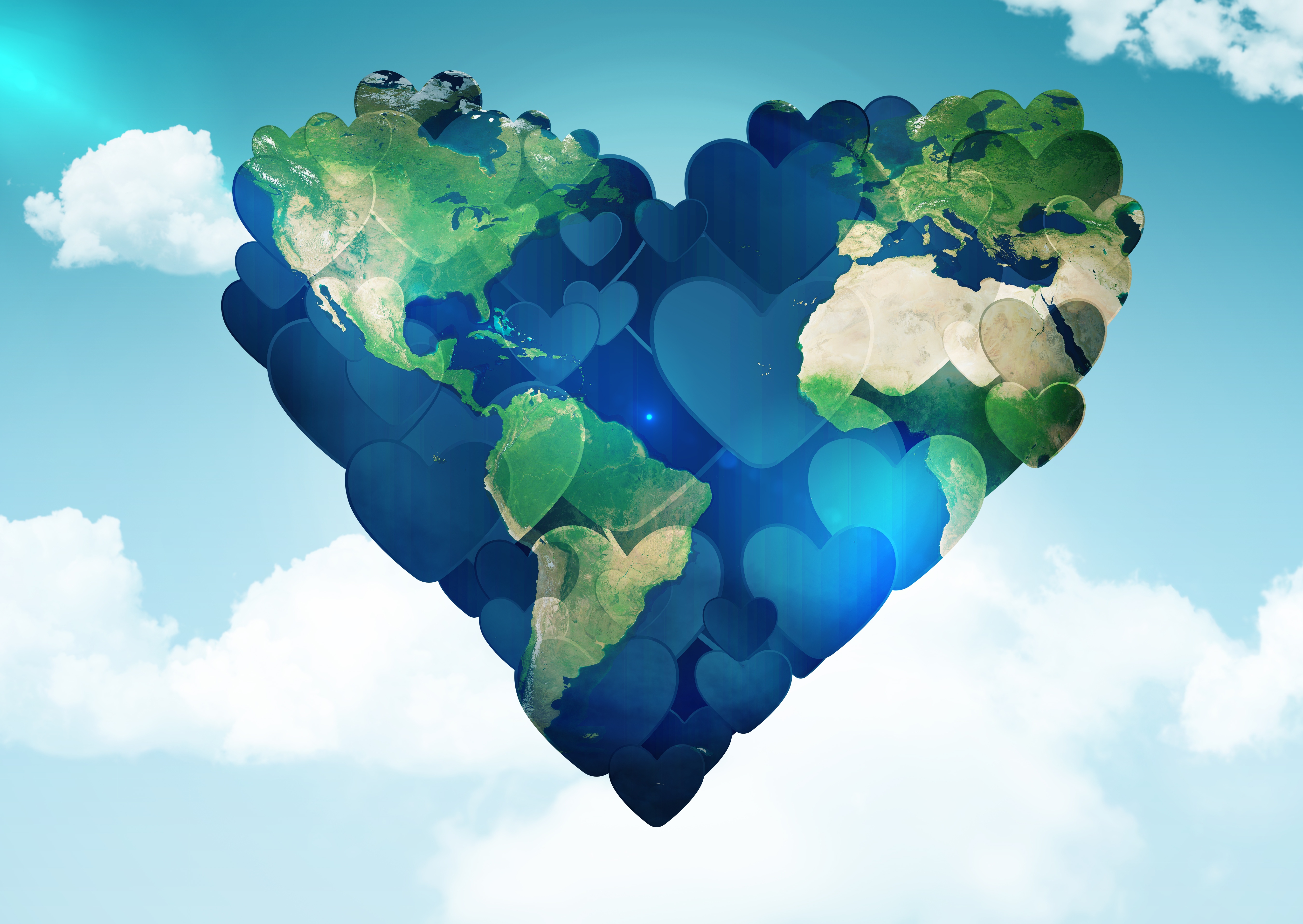 Earth in the shape of a heart with a sky background