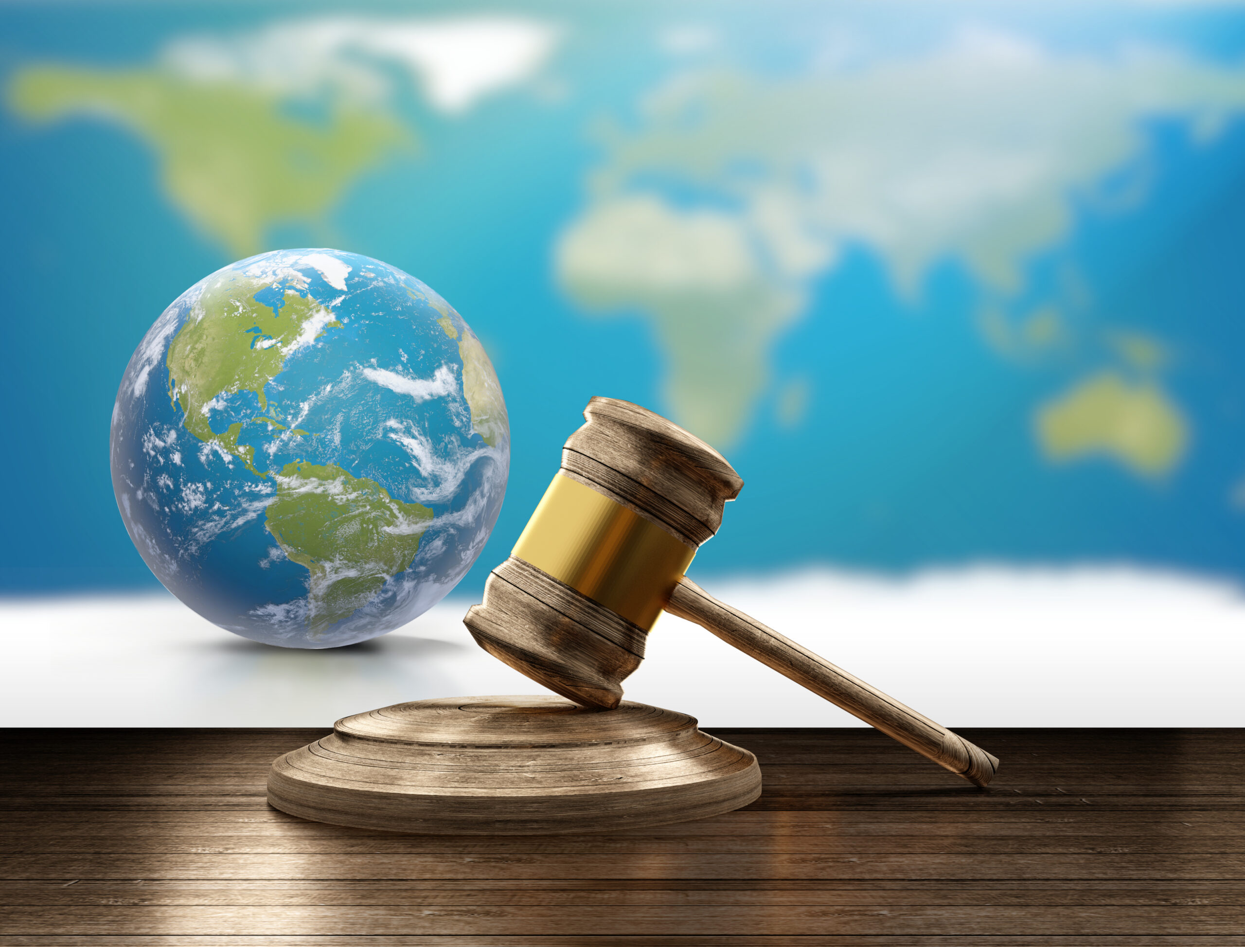 world map planet earth globe and wooden judge gavel 3d-illustration