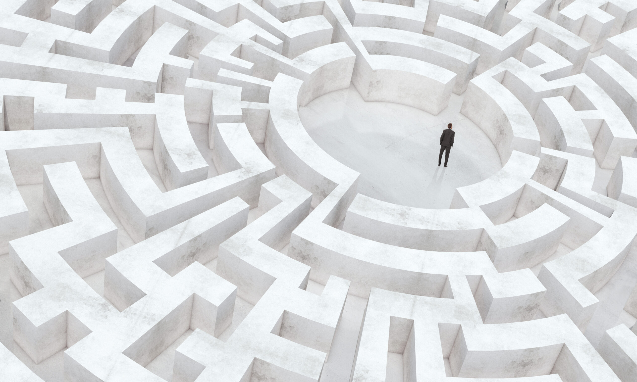 businessman in the middle of a maze (graphic)