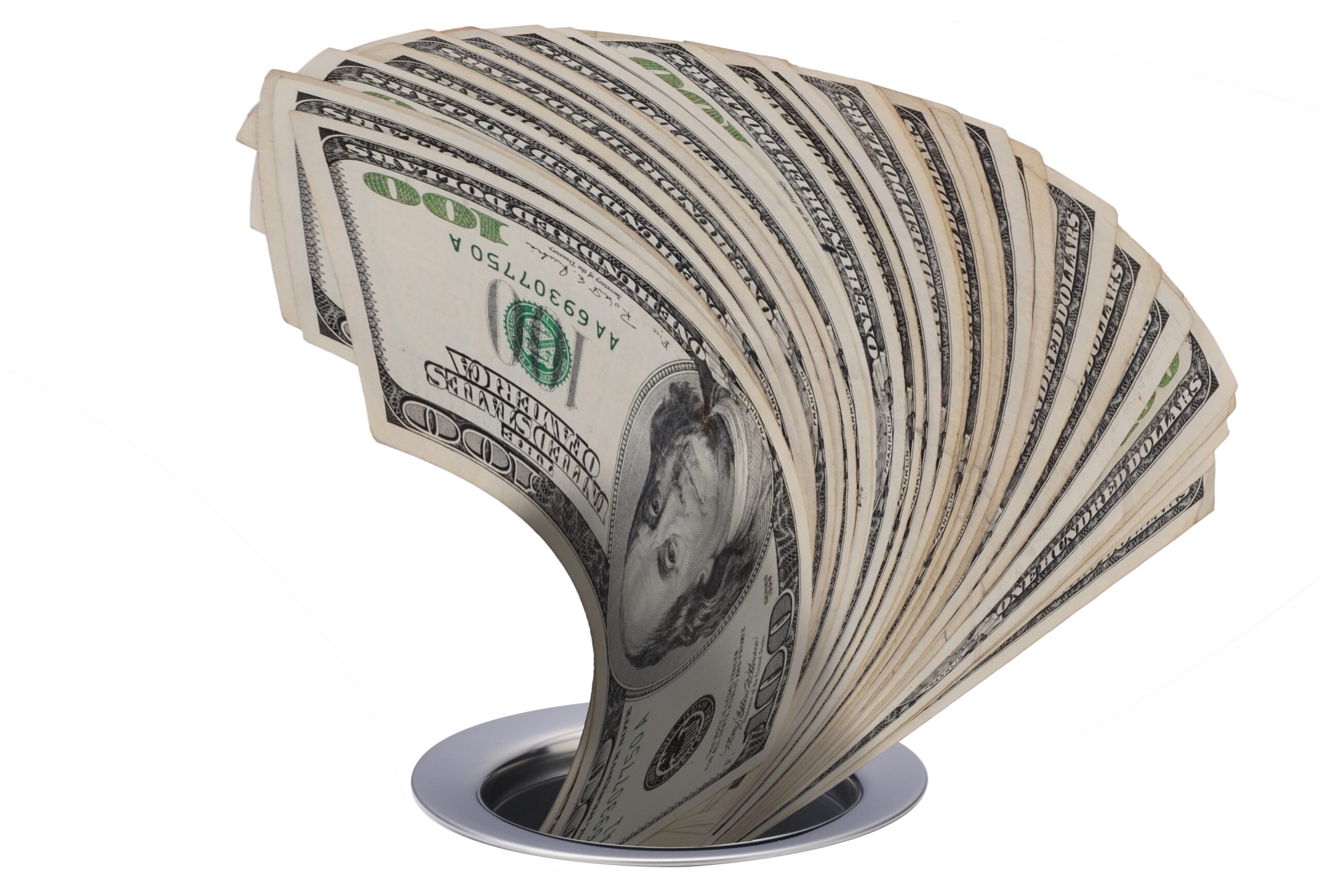 Stack of money going down a drain.