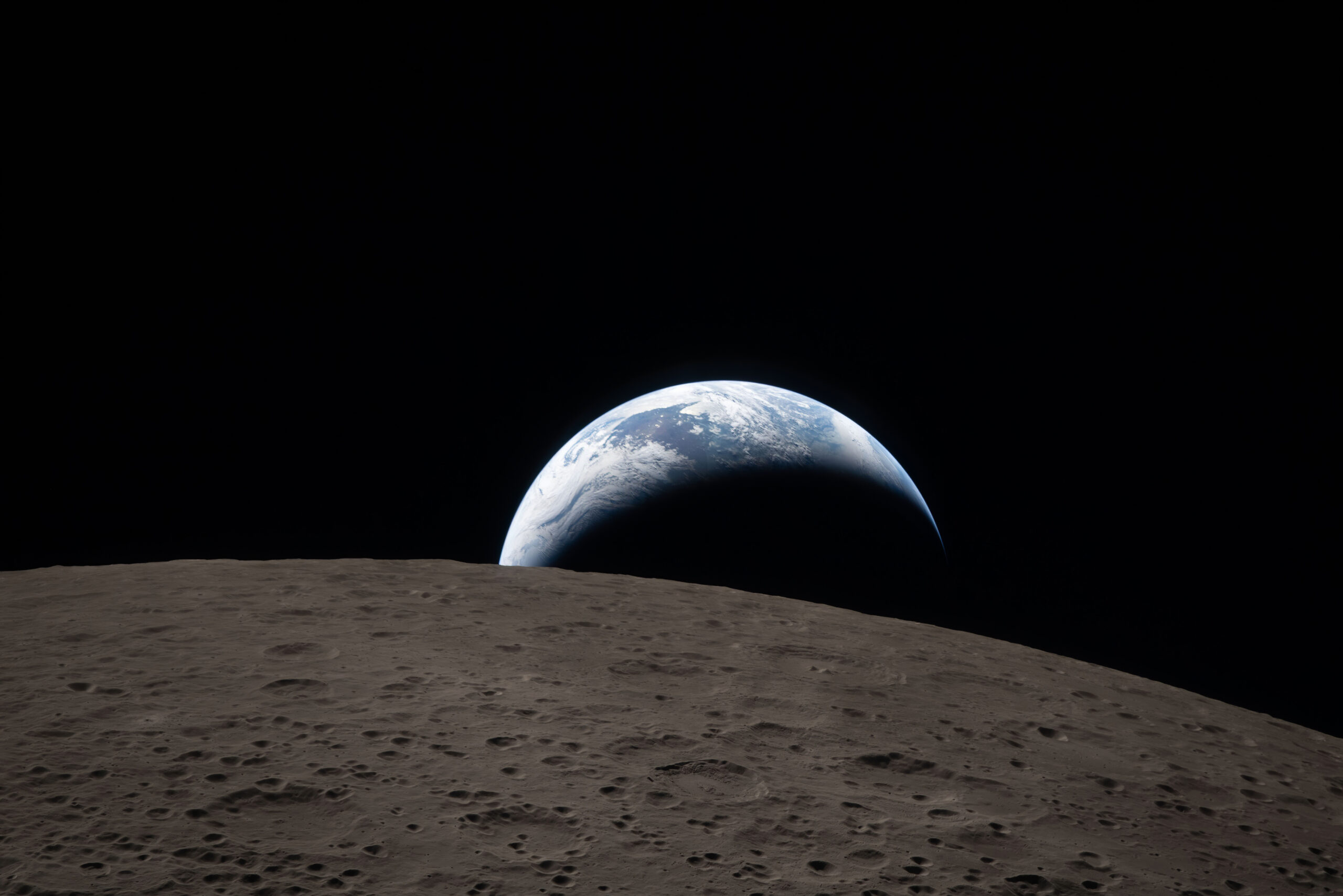 Atmospheric view of planet Earth rising over the cratered lunar surface.