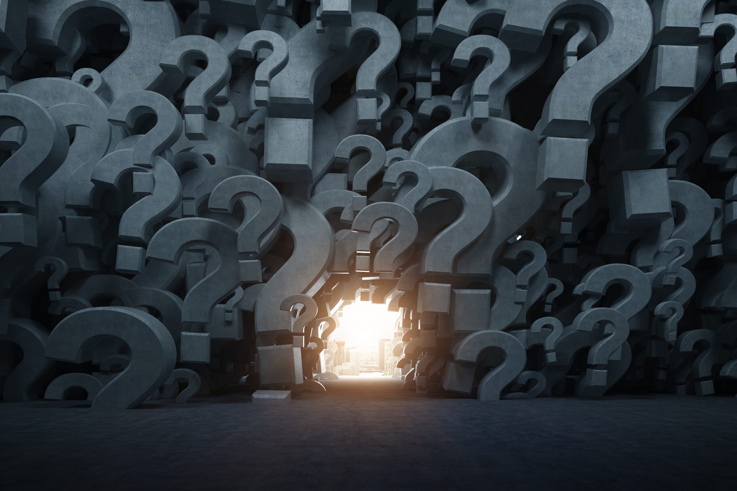 Empty room with gray 3d question marks on the walls and a lighted way out.