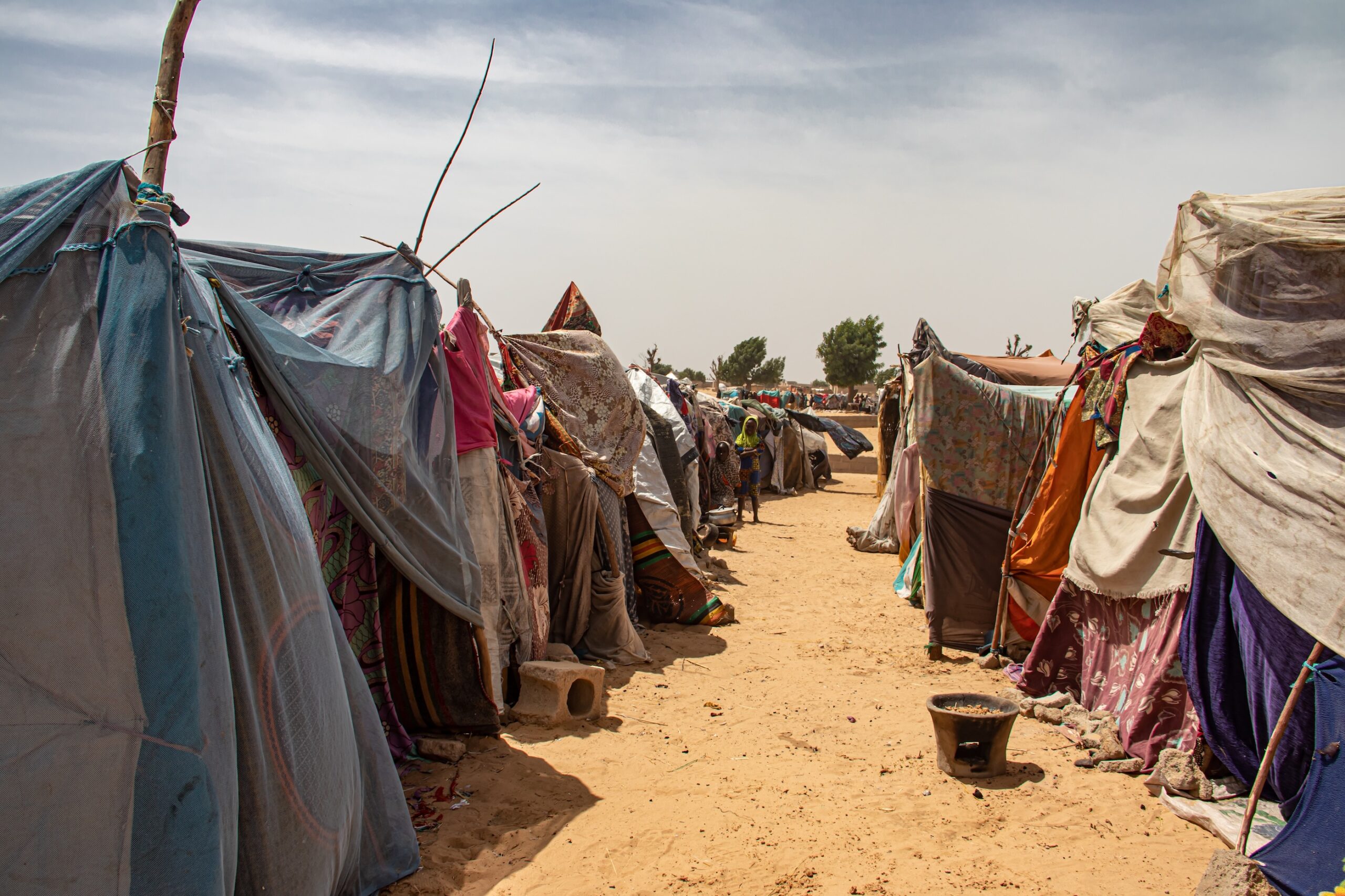 refugee camp - makeshift tents in a desert