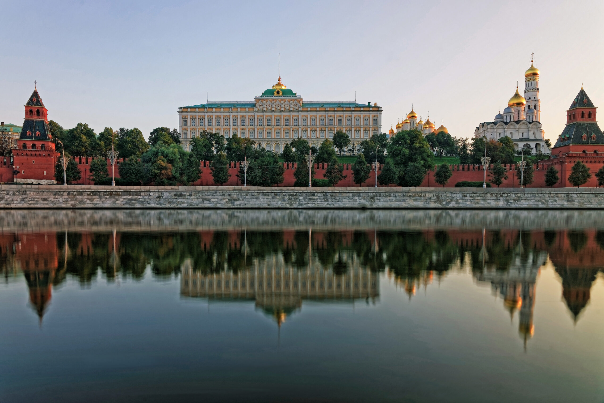 Kremlin with reflection on river in foreground