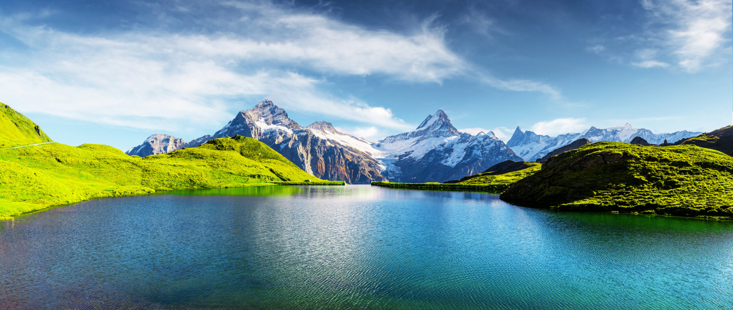 Lake with snowy peaks in background