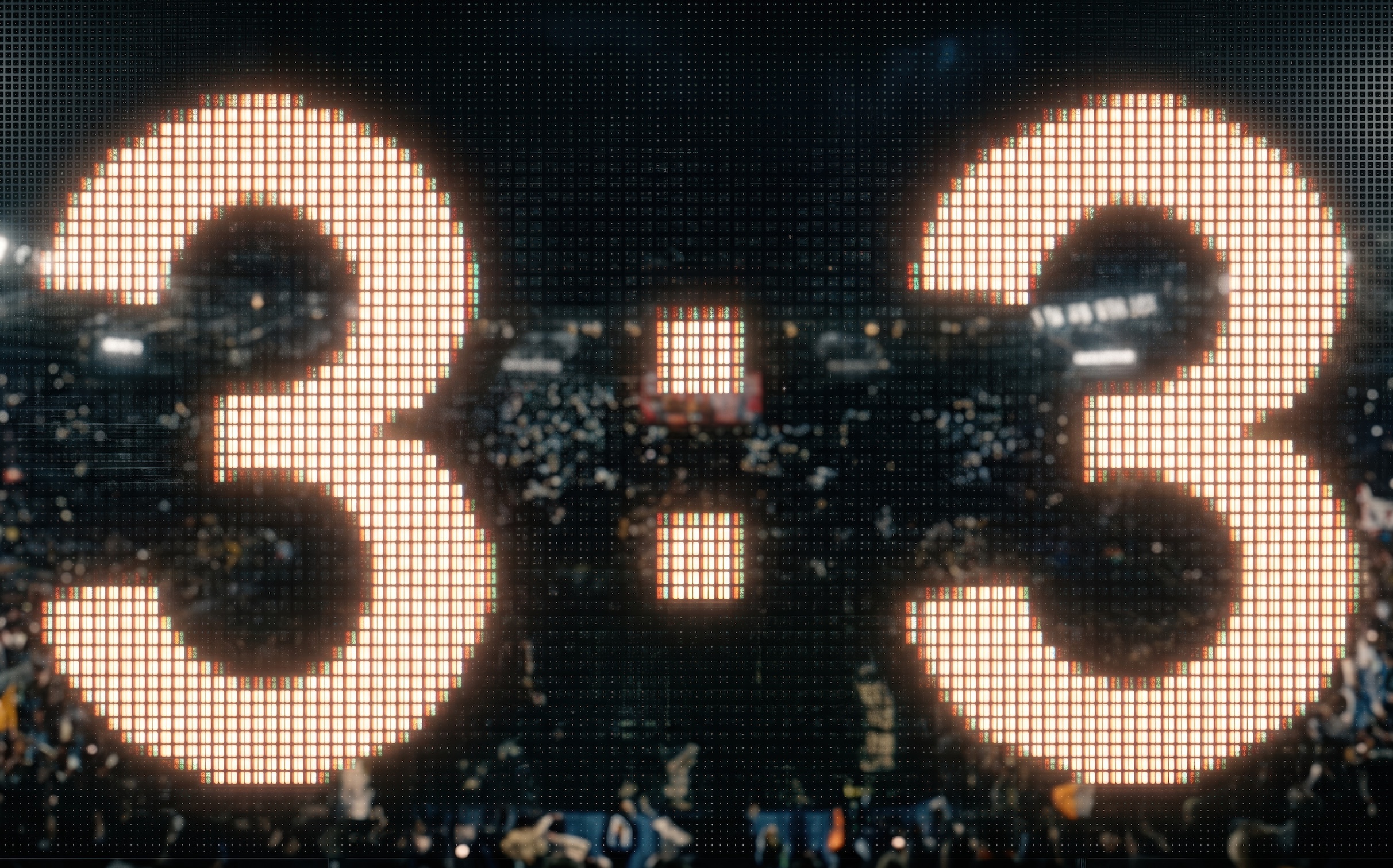 Scoreboard showing "3:3" against an image of a crowd