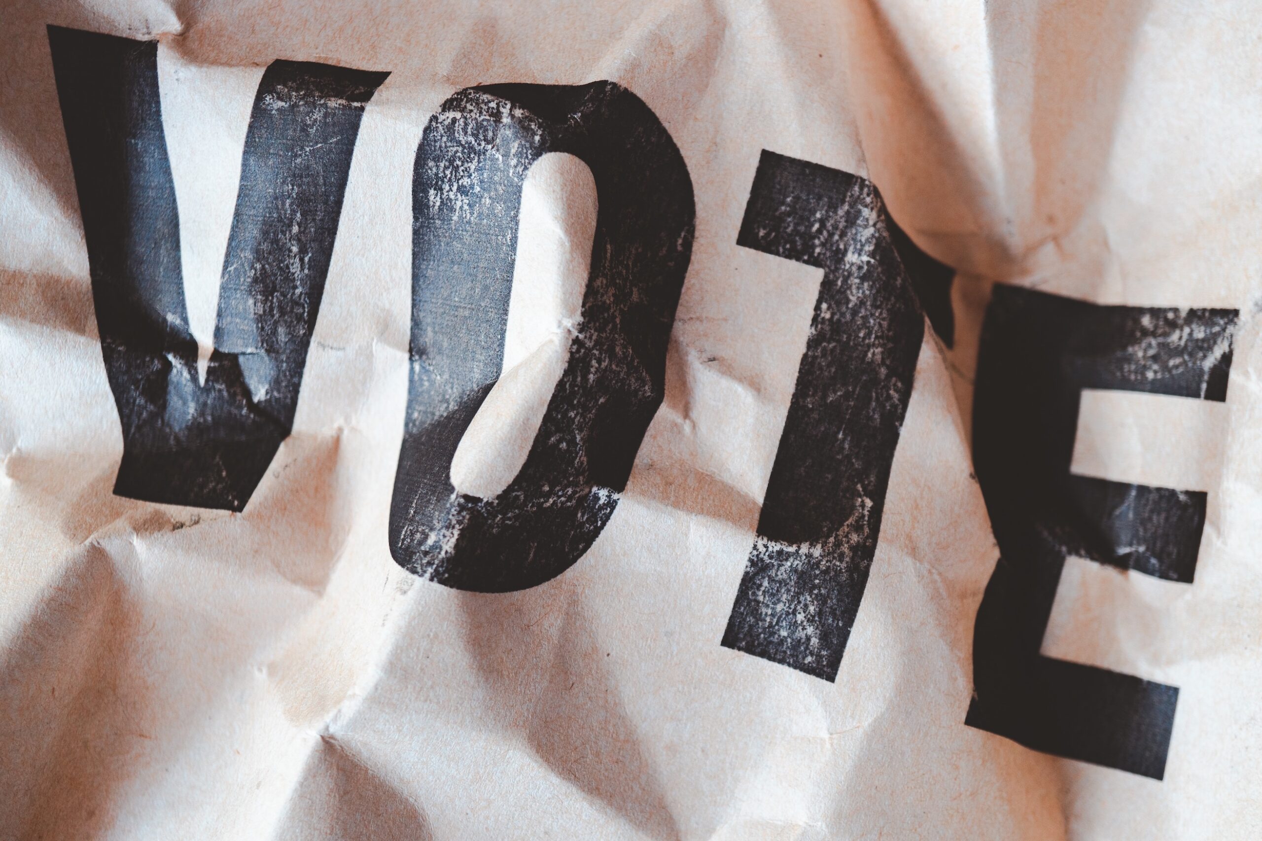 crumpled brown paper with word vote printed