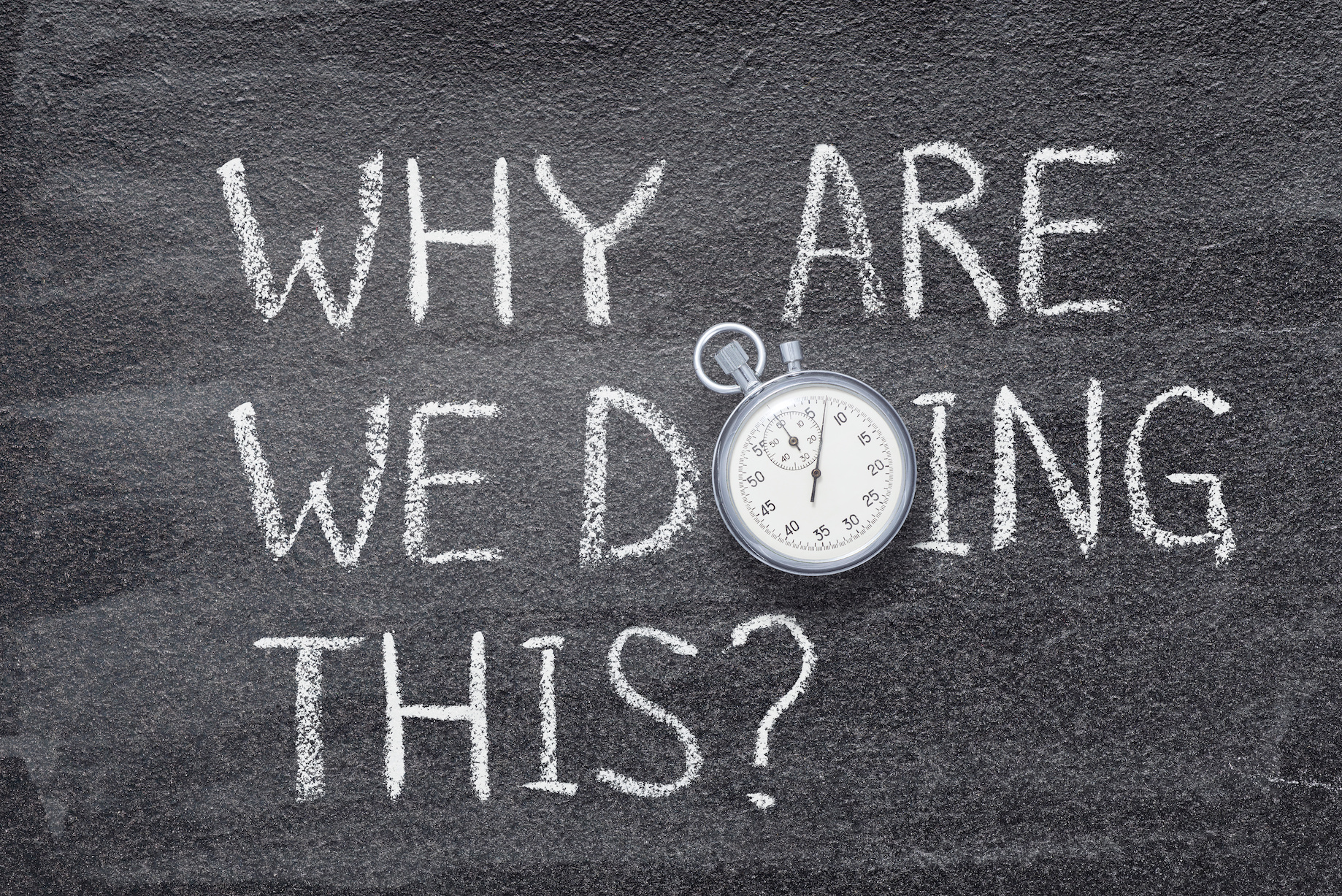 why we are doing this question written on chalkboard with vintage precise stopwatch